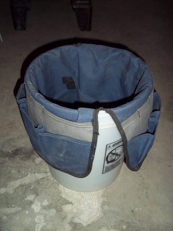 lot 73 image: Bucket with tool poach