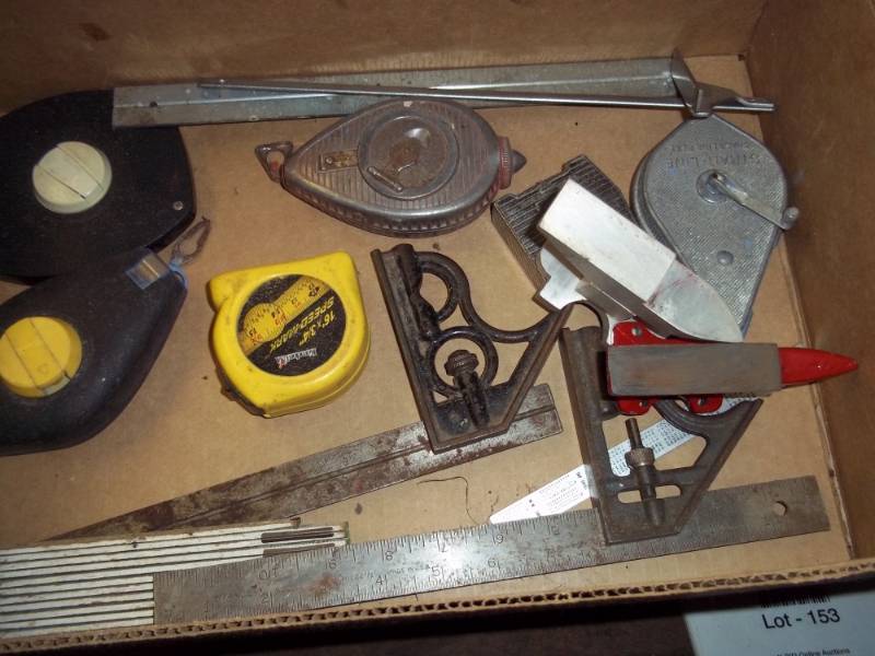 lot 157 image: Box of 2 squares, 2 measuring tapes, caulk lines