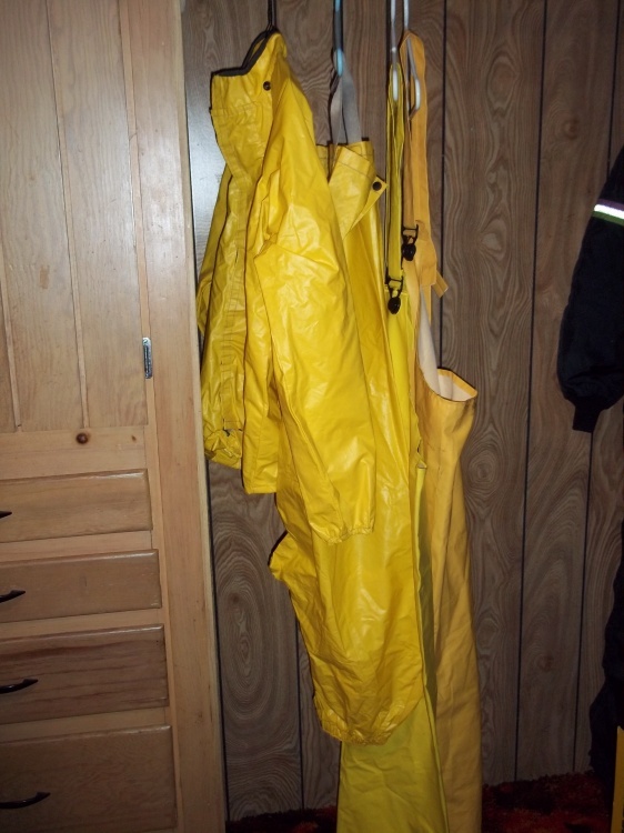 lot 242 image: Yellow rain gear with large top and large pants and 2 bibs
