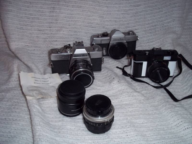 lot 296 image: 3 - 35mm cameras with 2 extra lenses