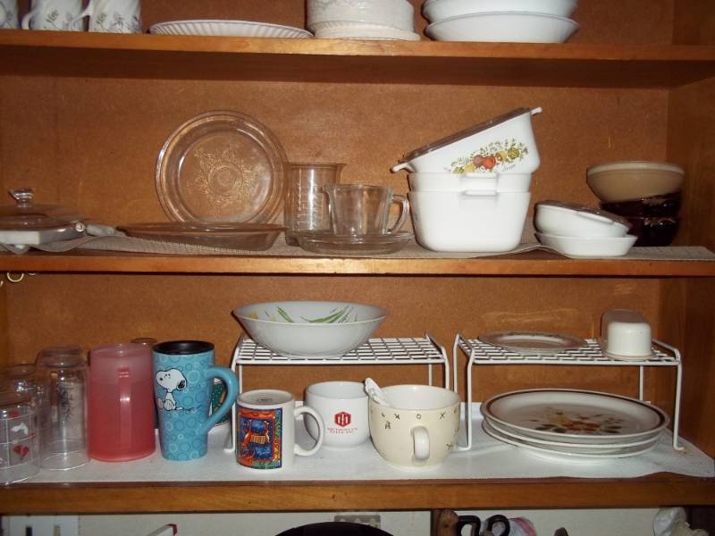 lot 340 image: 2 shelves of assorted dishes includes cups, bake ware, etc