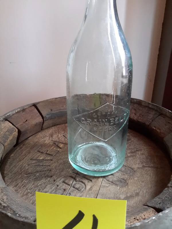 lot 4 image: Minneapolis Brewing Co, Wood Barrel and Vintage Grain Belt Beer Bottle