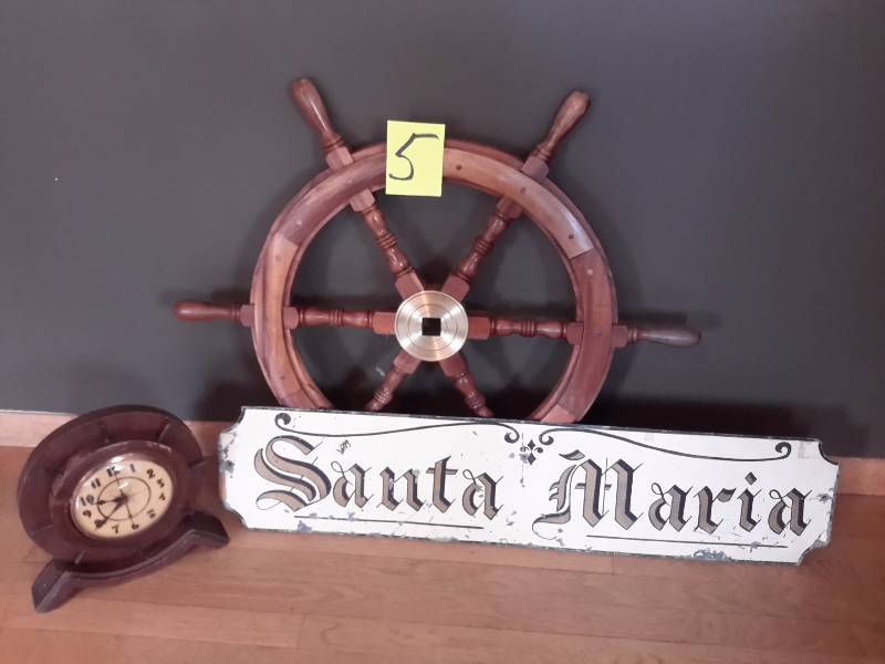 lot 5 image: Santa Maria Metal Sign.  Ship Steering wheel, Windsor Clock with wood frame