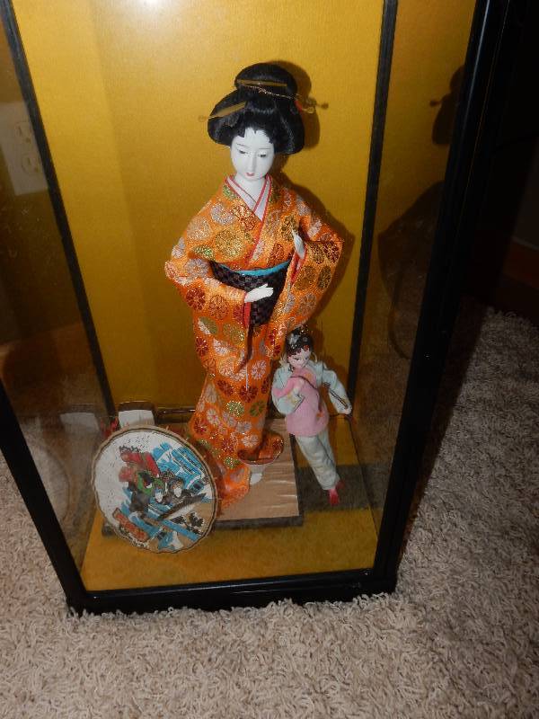 lot 62 image: Encased Asian Doll and other Asian Buddha Statuettes