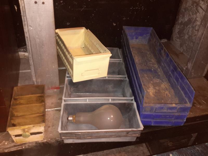 lot 97 image: File Cabinet, Wood Shelf, Bread Pan, 2 sets of Jumper cables, electric plates and items as shown in the drawer. Other items as shown.