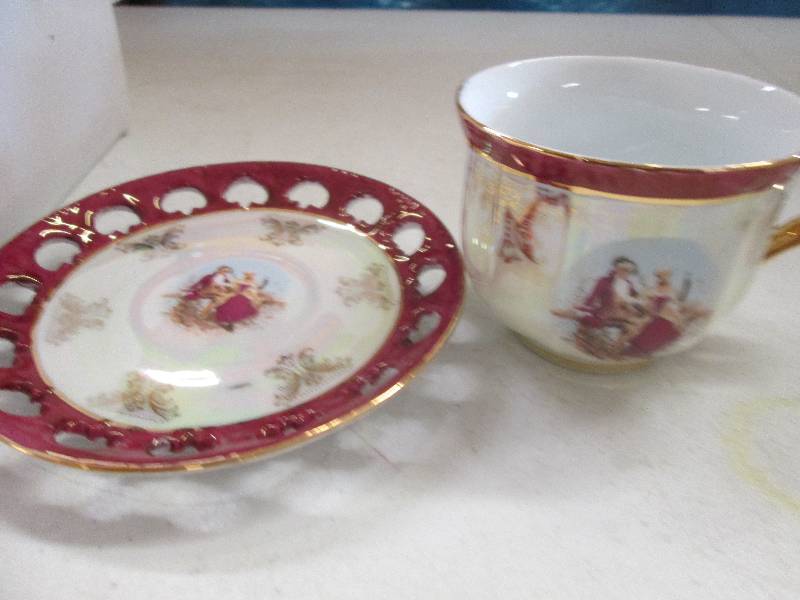 lot 13 image: 6 piece saucer and cup set of china...