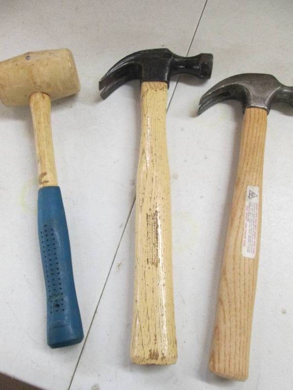 lot 23 image: 2 regular hammers and a rubber hamm...