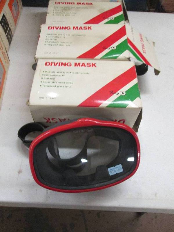 lot 63 image: 4 diving masks never used , 3 littl...