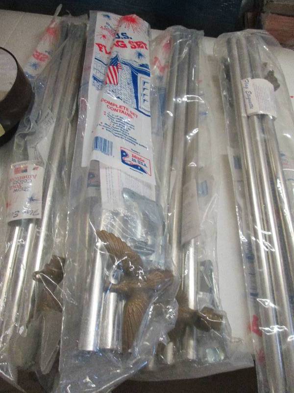 lot 85 image: flag pole kits and rolls of celepha...
