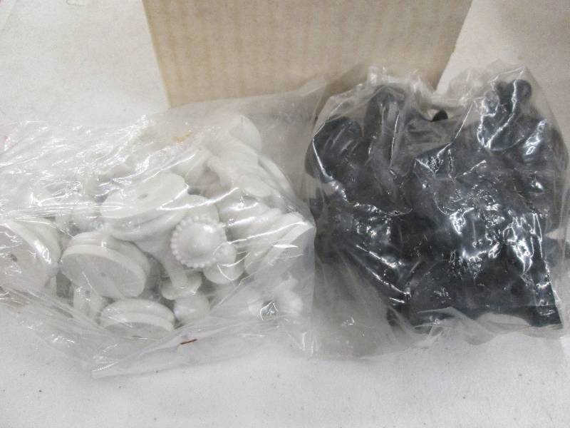 lot 270 image: box of white and black chess pieces...