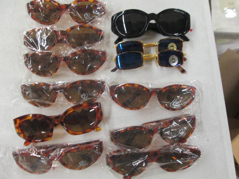 lot 374 image: 12 pairs of sunglasses...