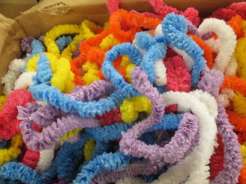 lot 379 image: big box of plastic leis...