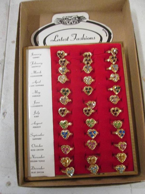 lot 389 image: 36 birthstone rings...