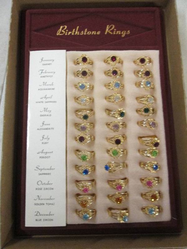 lot 391 image: 36 birthstone rings...