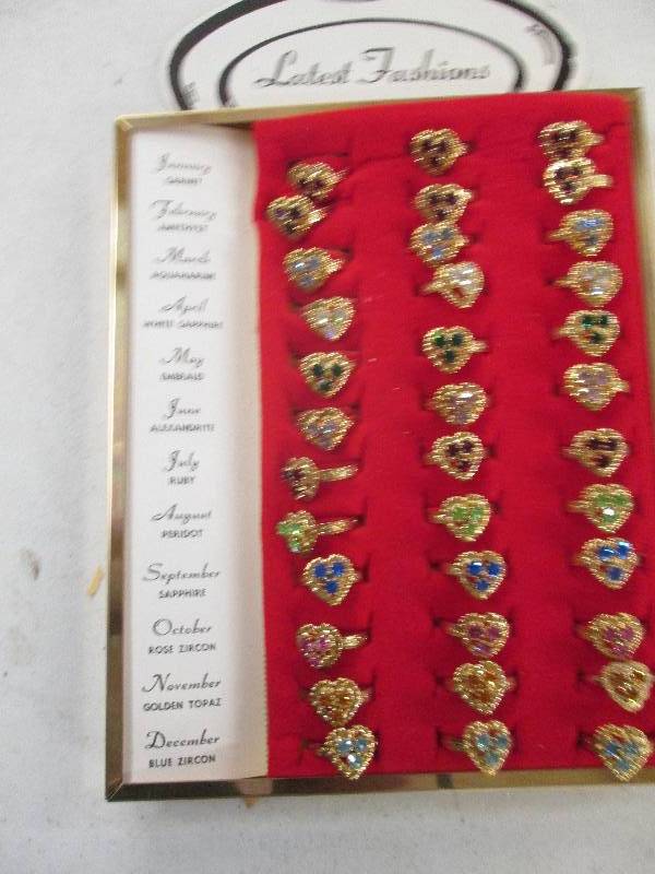 lot 399 image: 36 birthstone rings...