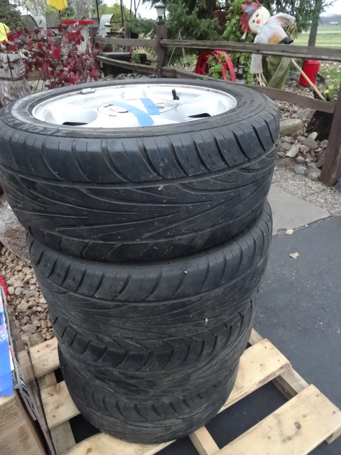 4 tires with aluminum rims