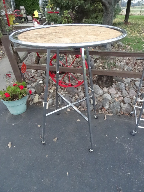 Metal clothing rack on wheels.