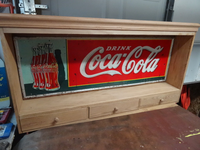 Custom wood cabinet with Vintage Coca Cola sign