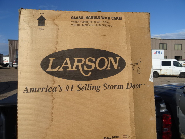 lot 4 image: Brand new Larson storm door.