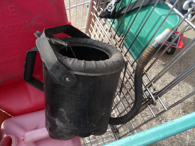 lot 27 image: gas cans and oil cans