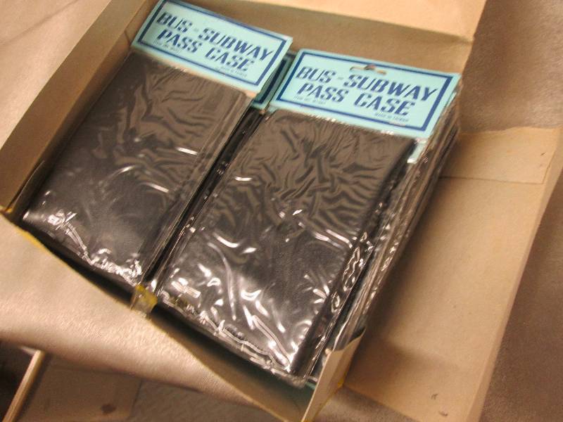 lot 24 image: Large Quantity Black Bus Pass Cases...