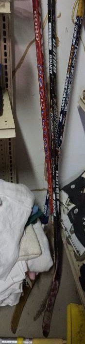 Lot of Sporting Good Rackets, Balls, and Hockey Sticks