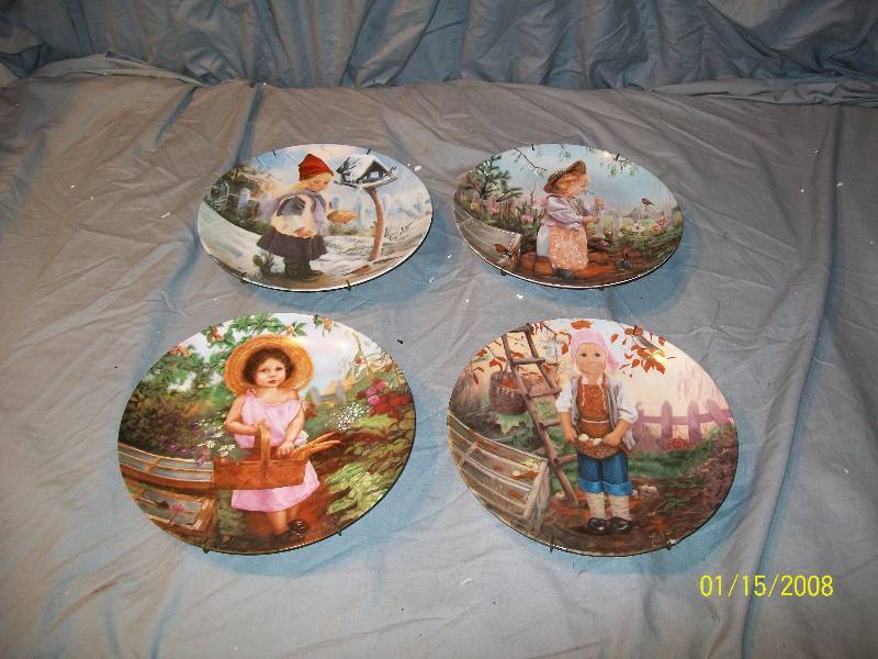 lot 11 image: 4 Collector Plates1983 Seasons the Little Darlings Series signed by Artist Von Ault with Plate Hangers.