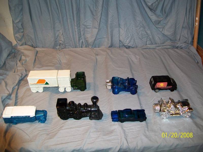 lot 20 image: 7 Avon Vintage Collectible Cars with Labels.