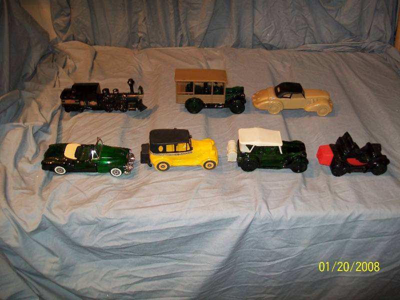 lot 22 image: 7 Avon Vintage Collectible Cars with Labels.