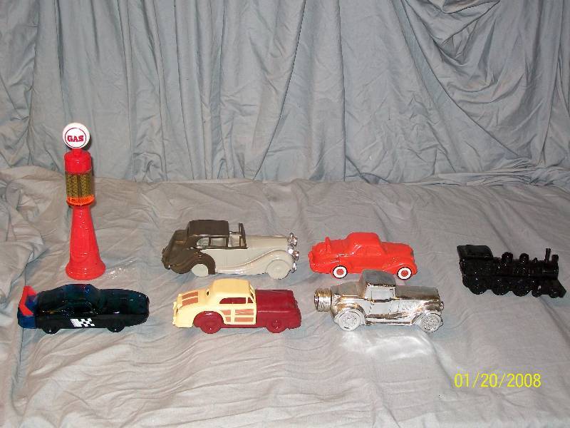 lot 24 image: 7 Avon Vintage Collectible Cars with Labels.