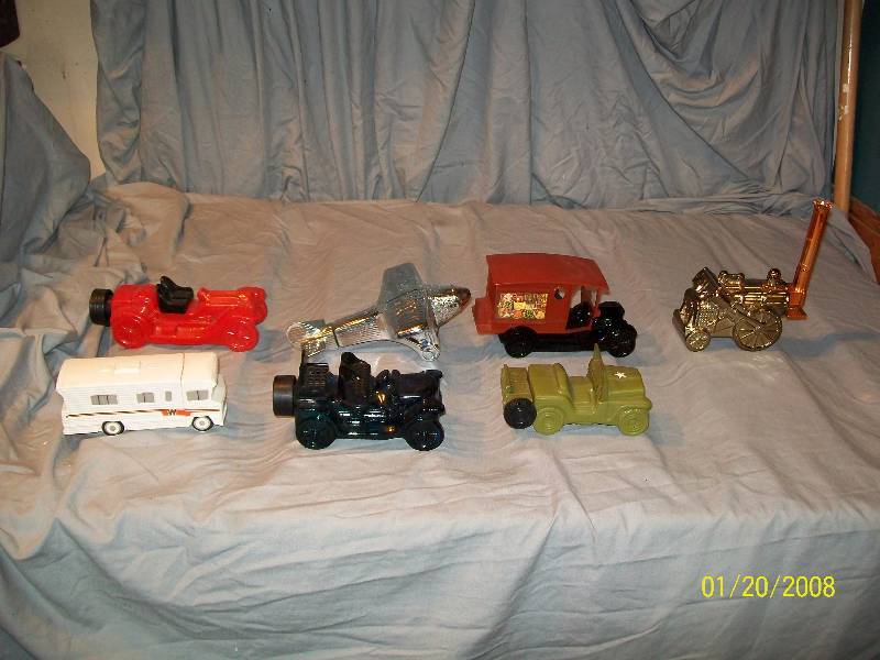 lot 23 image: 7 Avon Vintage Collectible Cars with Labels.