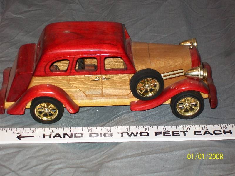 lot 31 image: Exquisite Multi Wood Touring Model Car with Rubber Wheels, 12 long