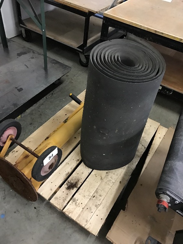 lot 84 image: Roll of rubber mat and metal stand