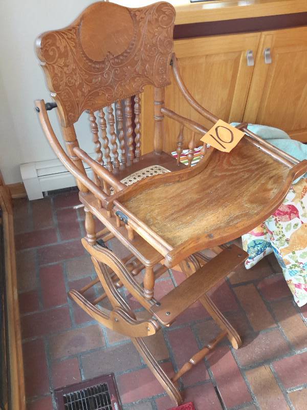 lot 10 image: Antique High Chair.. Maple wood with caned seat..