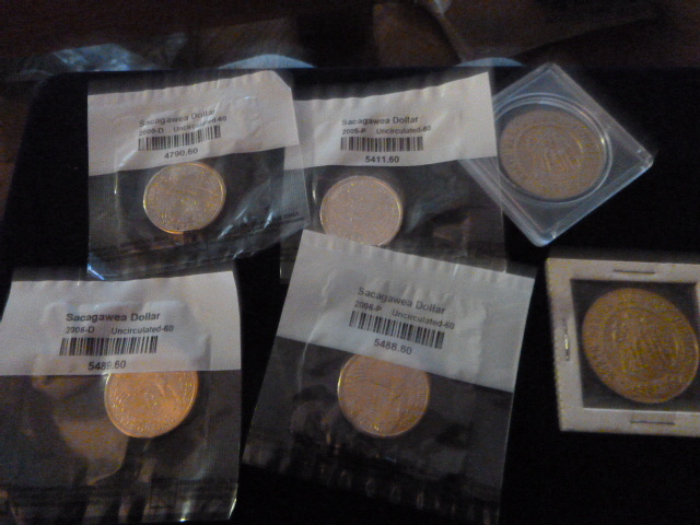 4 Sacagawea Uncirculated Dollar Coins and 2 North Dakota Diamond Jubilee Coins