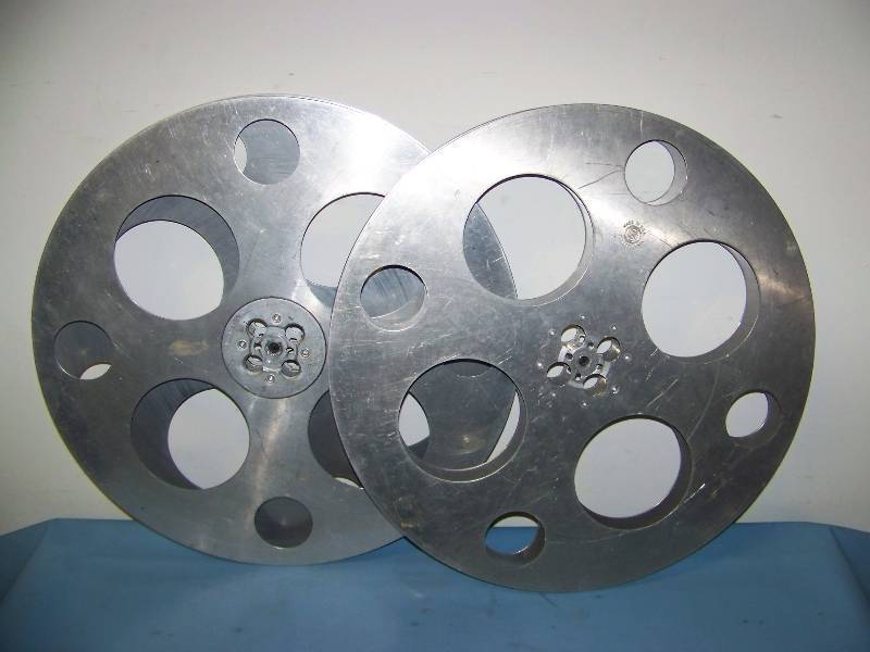 lot 25 image: (2) Goldberg Bros. Inc., E-Z Hub, Film  Movie Reels, (1) Scene Marker and 80s Film on Reel