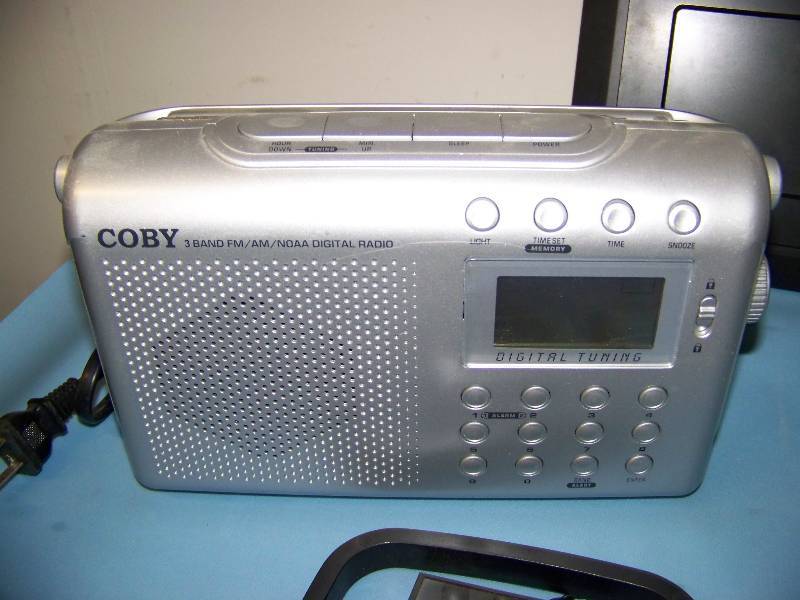 lot 69 image: Digital Camera, AMFM Radio, Mn Twins iPod Dock, Electronic Chess Game, Family Tree Make Software and more