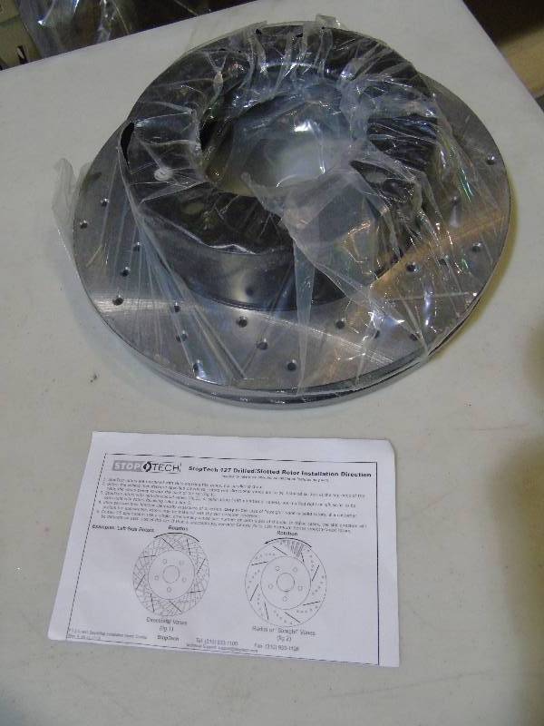 lot 35 image: Stop Tech 127.65112L Sportstop Slotted and Drilled Brake Rotor
