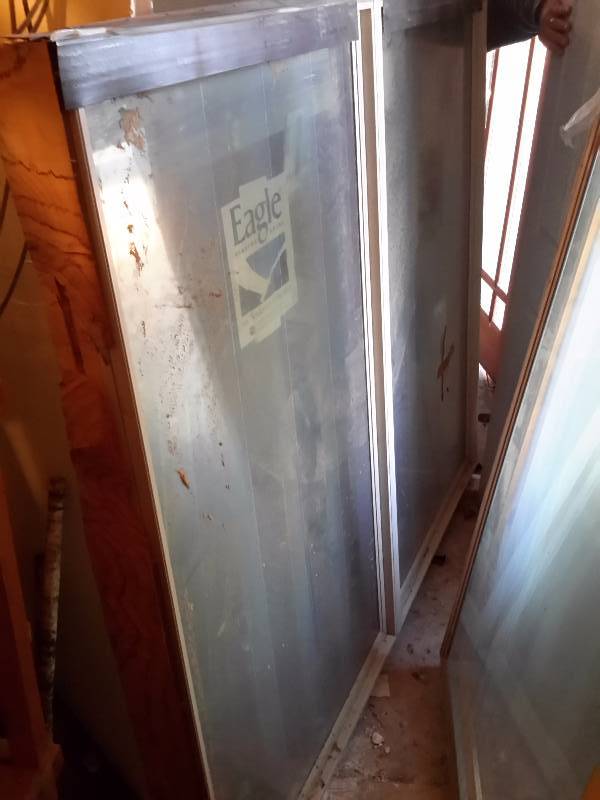 33 12 in x 57 18 h x 2,  EAGLE WINDOW, have blinds built in