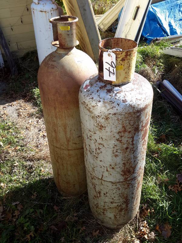 2, 100 lb propane gas tanks..