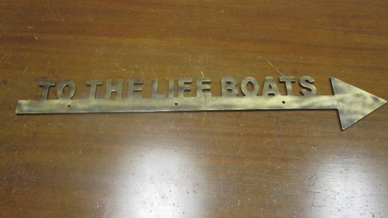lot 22 image: Aged brass heavy sign reads To The Lifeboats