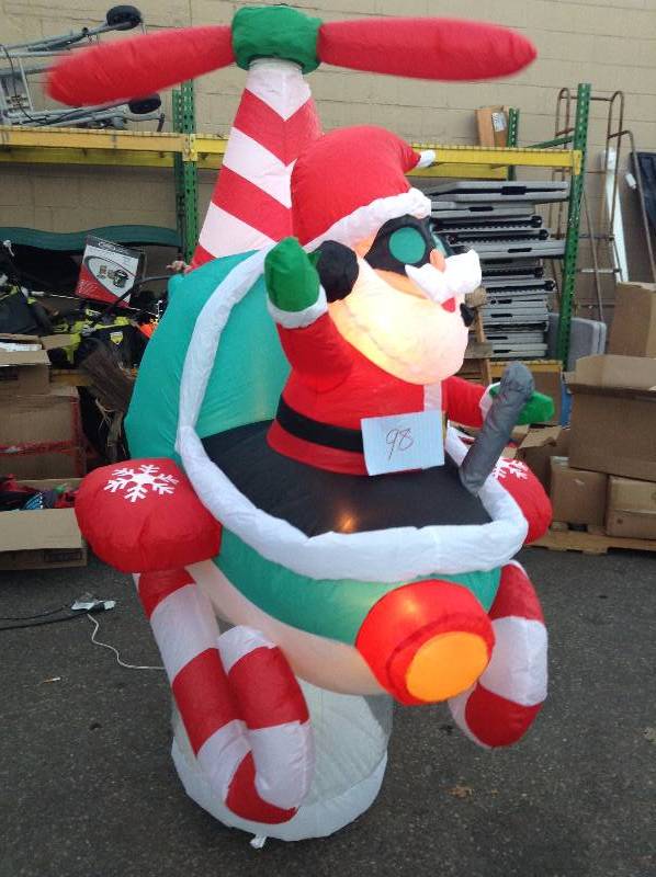 lot 98 image: Animated Inflatable Santa Claus In Airplane Christmas Dcor