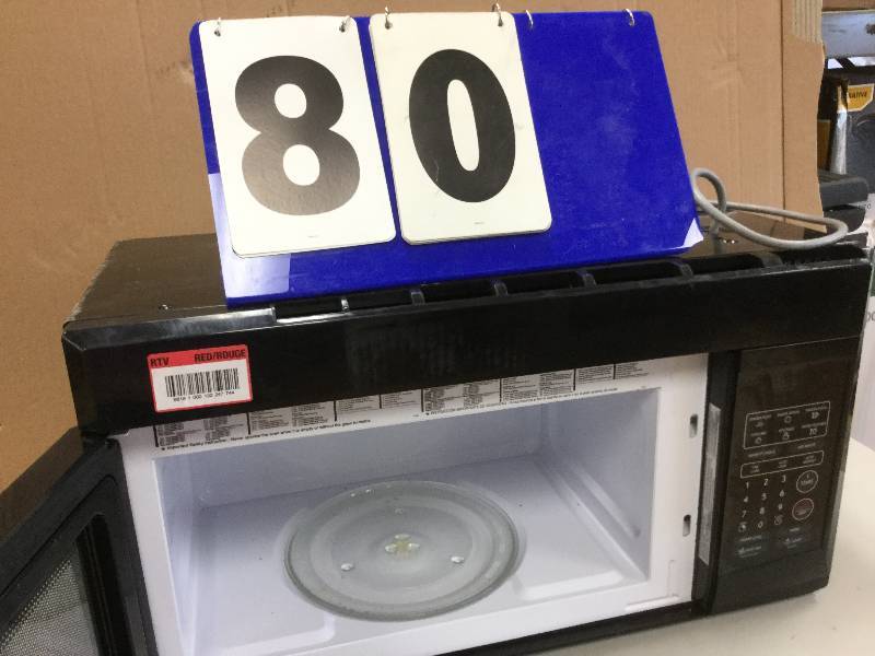 lot 80 image: Magic Chef  1.6 cu Microwave in Black in working conditions small damage on the cornerd