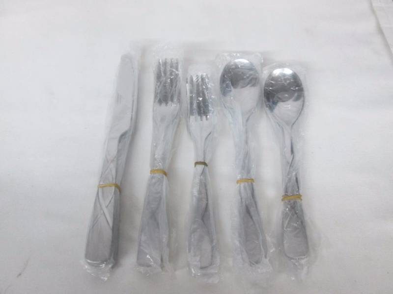 lot 71 image: Farberware Cilantro Sand 20-pc. Flatware Set