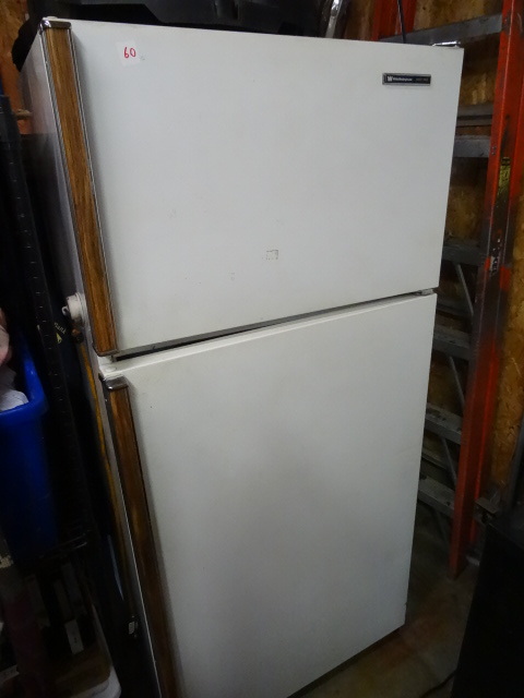 lot 60 image: White Westinghouse Fridge Freezer.