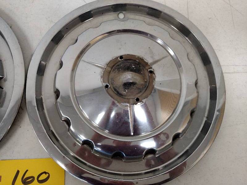 lot 160 image: (2) 1957 Chev. Wheel Covers...