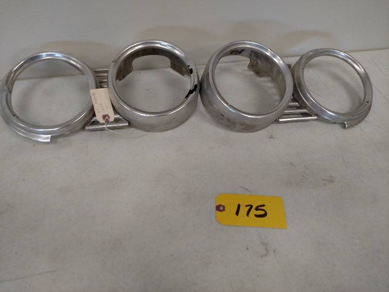 lot 175 image: Pair of 1961 Impala Headlight Bezel...