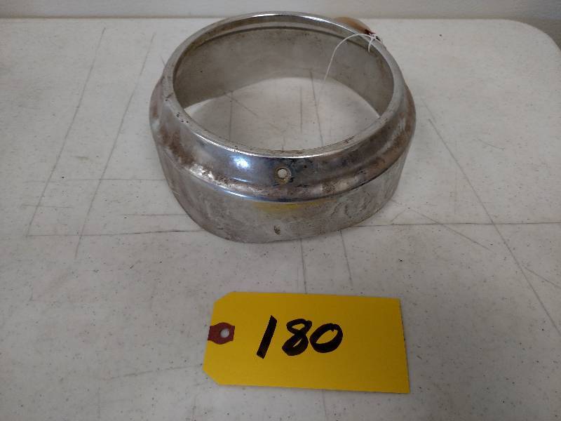 lot 180 image: 1960 Chev. Left Outer Headlight Bez...