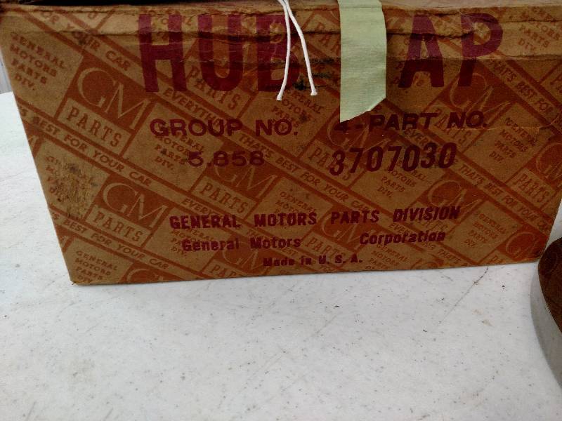 lot 469 image: (4) 54 Chev. Hub Caps, NOS...