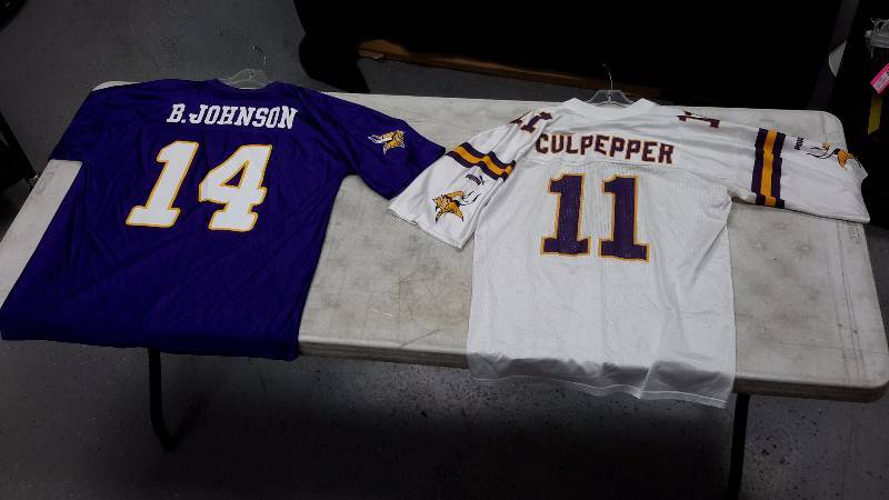 lot 34 image: Pair of Vikings jerseys